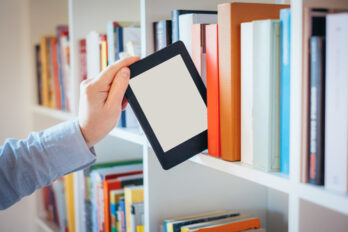 E-book,Reader,And,Colorful,Bookshelf