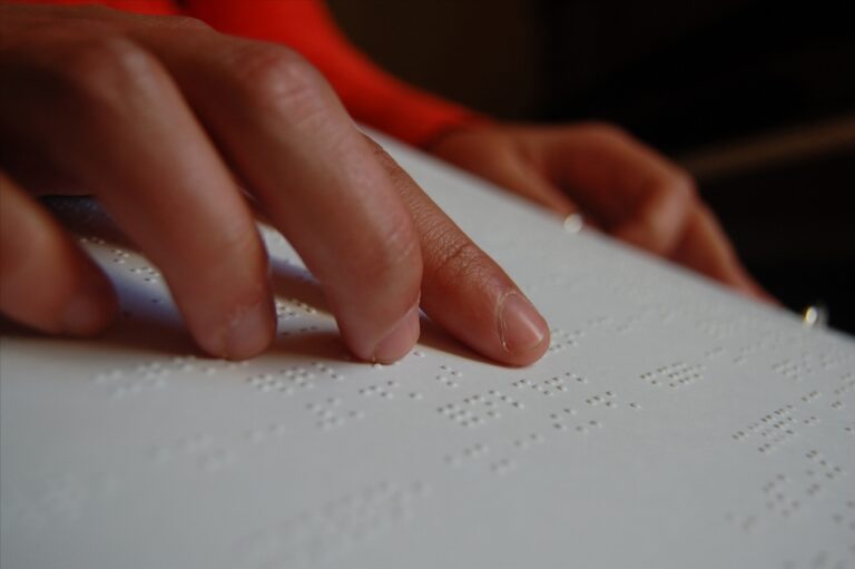 A,Blind,Woman,Uses,Her,Hand,To,Read,Music,Notation