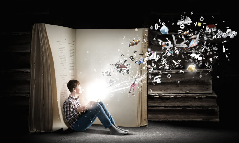 Teenager,Boy,In,Jeans,And,Shirt,Reading,Book
