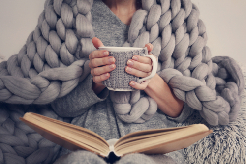 Cozy,Woman,Covered,With,Warm,Soft,Merino,Wool,Blanket,Reading