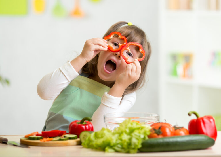 Kid,Girl,Having,Fun,With,Food,Vegetables,At,Kitchen