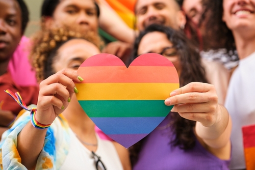 A,Group,Of,Lgbtq,People,Holding,A,Rainbow,Heart,Celebrating
